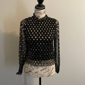 Cute Girl’s top in black and gold sheer fabric with lining underneath